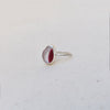 Side view of sterling silver ultra rare red and white multi coloured sea glass ring